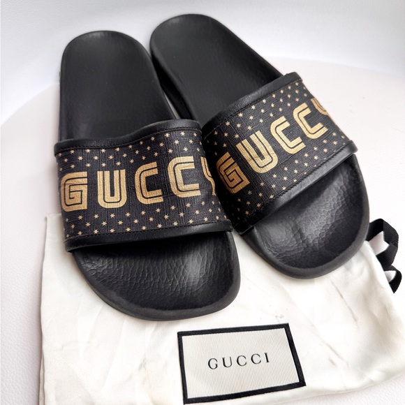 Gucci Shoes - GUCCI ‘guccy’ logo gold black rubber pool slides 38